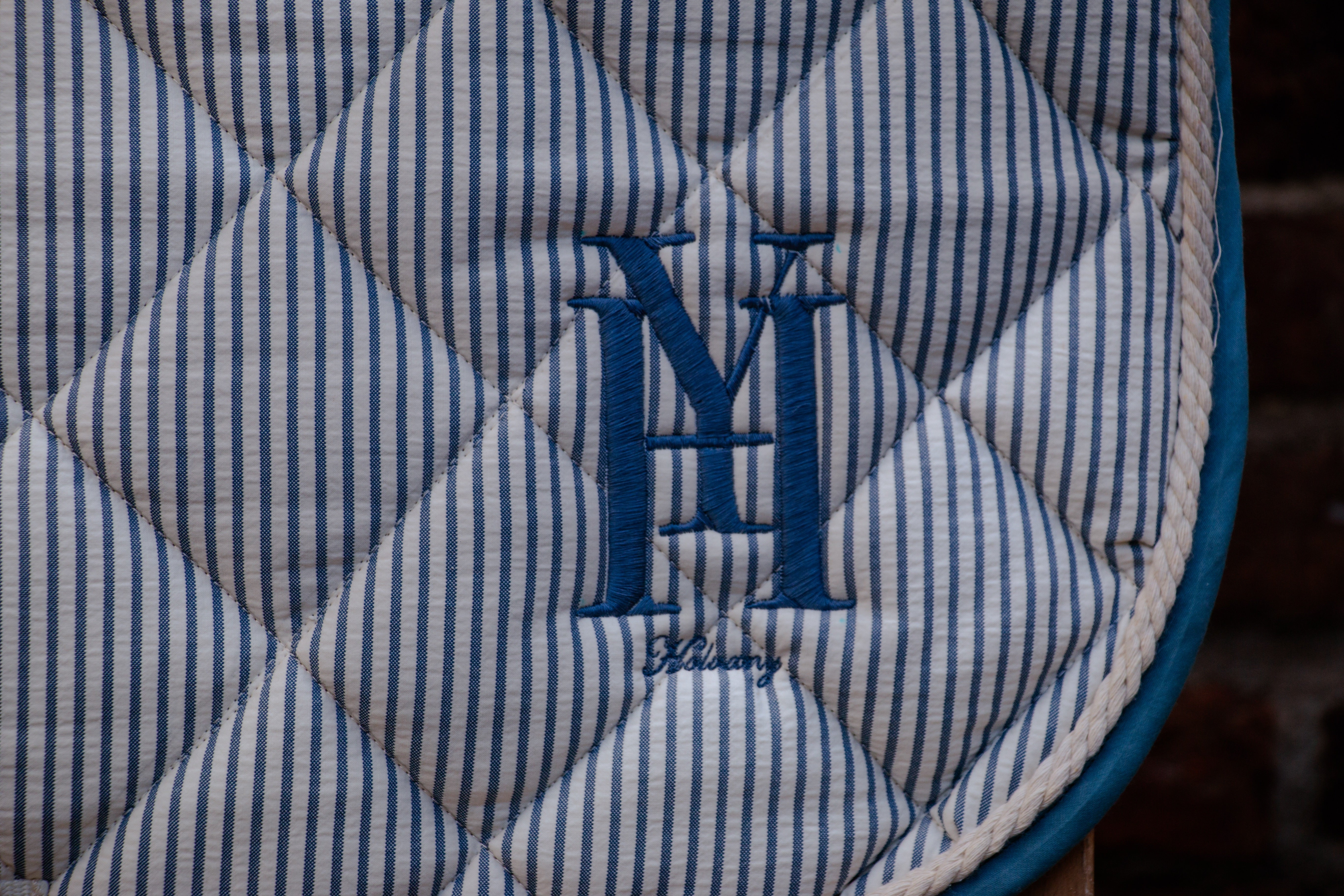 Blue striped dressage saddle pad