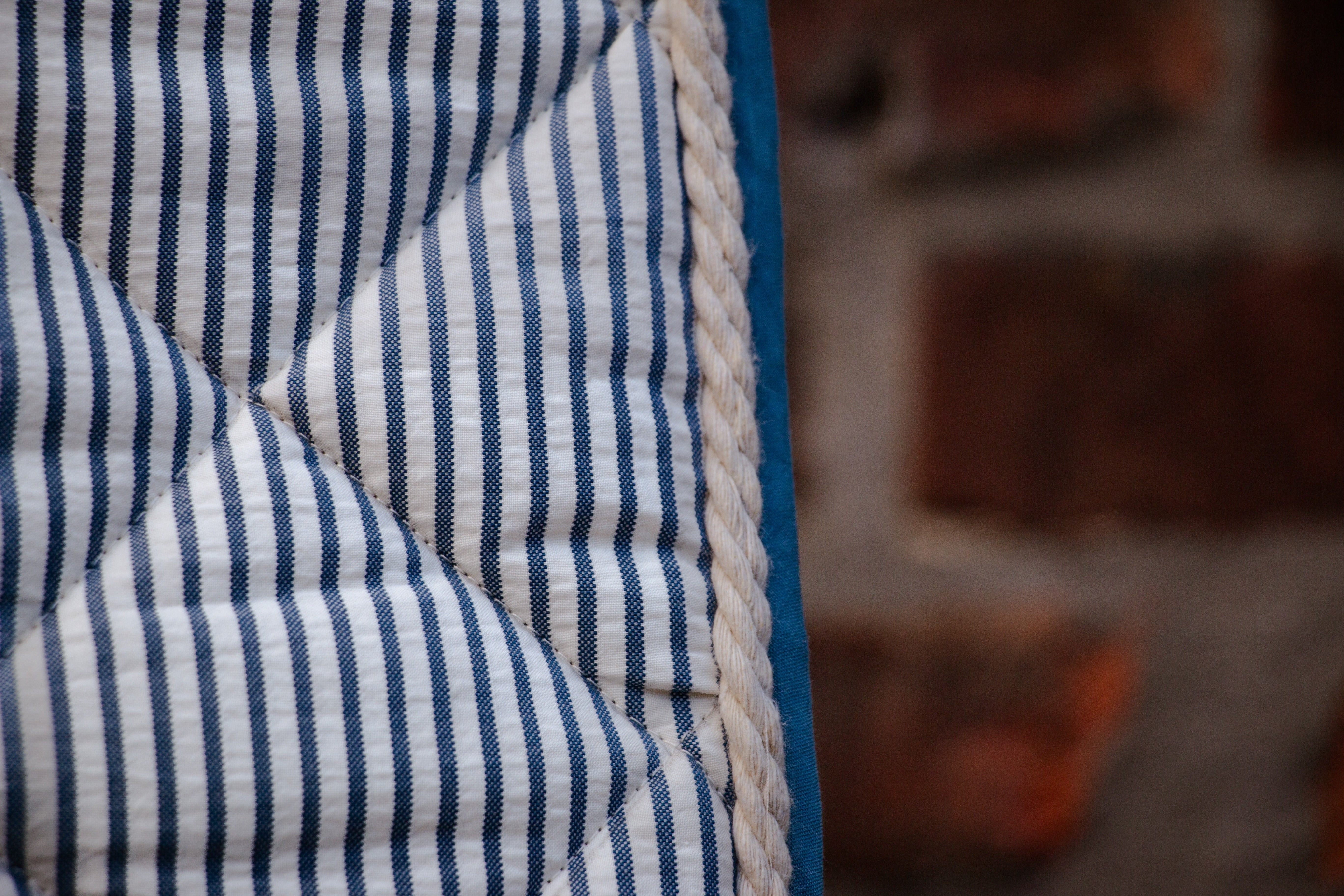 Blue striped dressage saddle pad